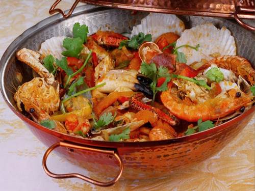 cataplana is a traditional dish from algarve and it is served with lots of fish and shellfish